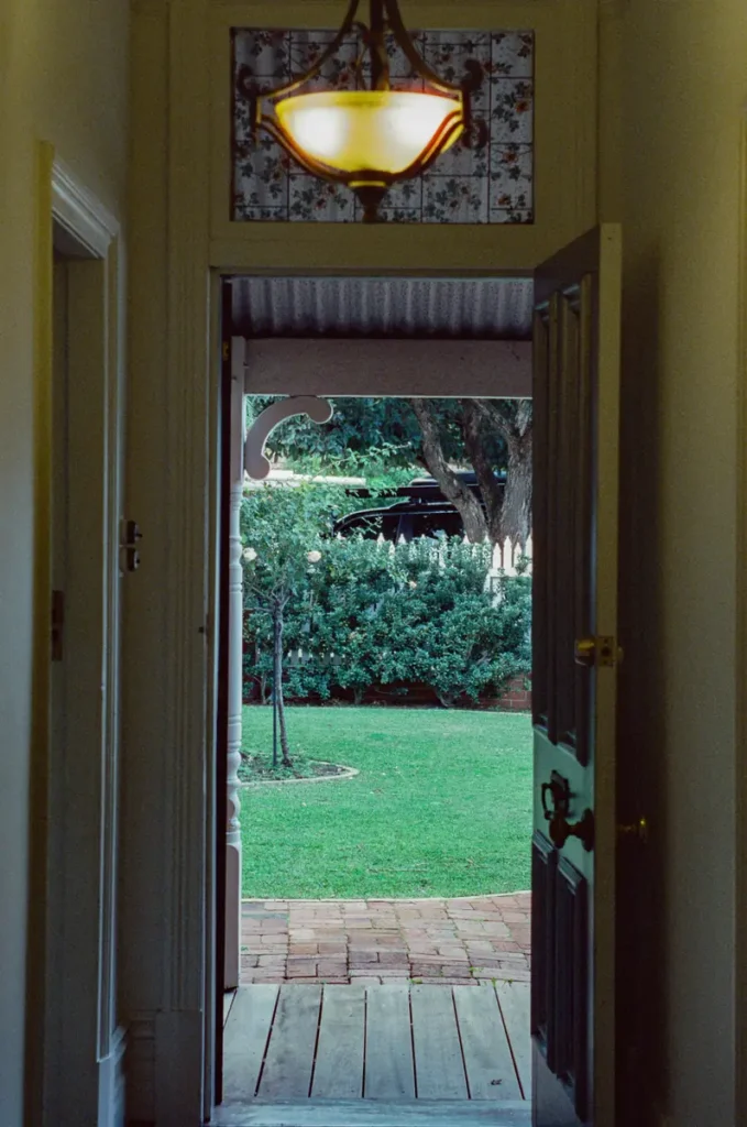 The entry hall at The Sapphire House looking out through an open door to the front lawn