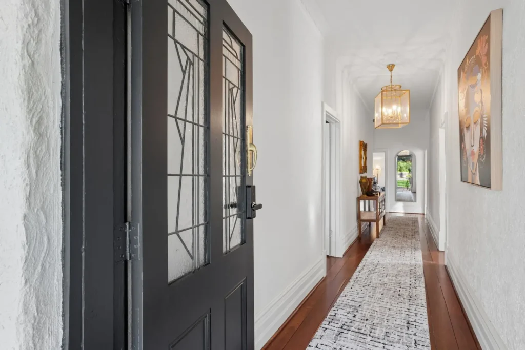 The entry hall at The Mooring Inn, a brass lantern above encaustic tile